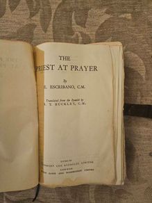 The Priest At Prayer. By E. Escribano. C. M. 1958 Leather Covered Hardback In Poor Condition.  See Photos For Same.