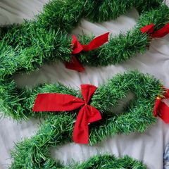 Green Christmas garland with red bows 2,5m