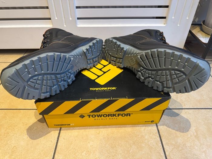 Steel toe safety boots.