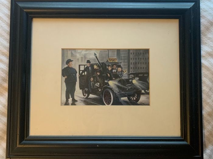 Framed pictures of Charlie Chaplin & Laurel and Hardy