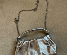 New silver mango clutch