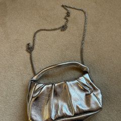 New silver mango clutch