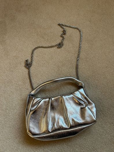 New silver mango clutch