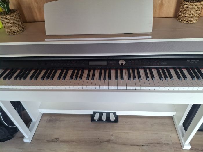 White Thomann piano