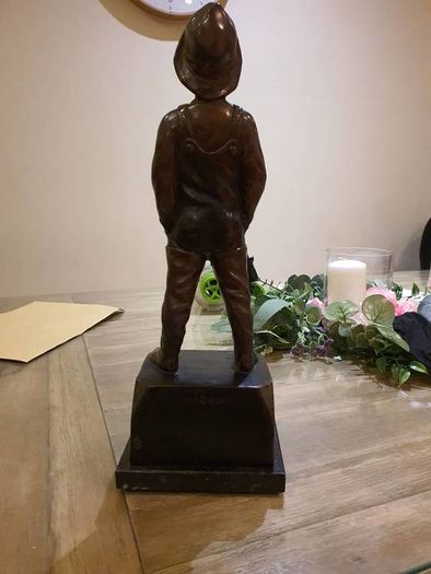 Fisher boy, bronze statue