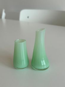 Two mini green glass vases