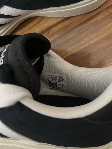 Black and white adidas shoes
