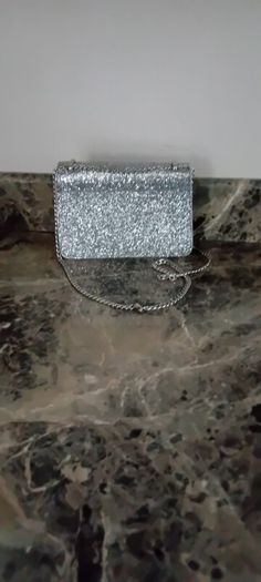 silver sandals and bag