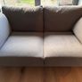 2 x Two seater dark grey couch and footstool - excellent condition Image 7