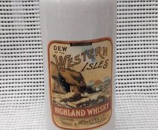 Dew of the western isles ,highland,,Train & McIntyre Ltd Glasgow whiskey jug/bottle ,see pictures for condition, sold as is ,,hard to come by, little damage chip on rim ,see pictures