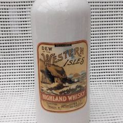 Dew of the western isles ,highland,,Train & McIntyre Ltd Glasgow whiskey jug/bottle ,see pictures for condition, sold as is ,,hard to come by, little damage chip on rim ,see pictures