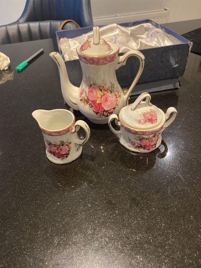Vintage Porcelain small teapot sugar bowl and creamer set .       porcelain