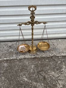 Ornate brass scales