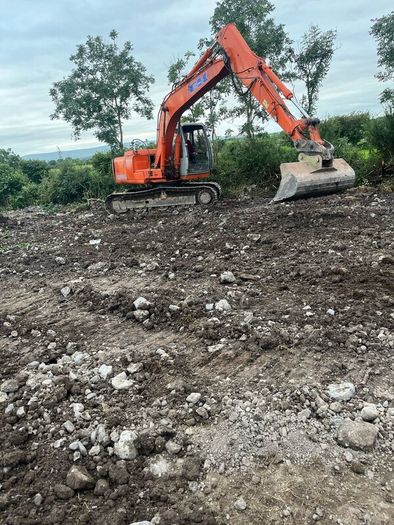 Man and digger for hire