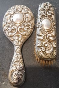 Antique stamped brush and a hand mirror