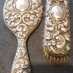 Antique stamped brush and a hand mirror