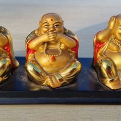 Three brass Buddha figurines