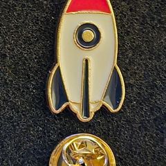 Rocket , pin back badge.