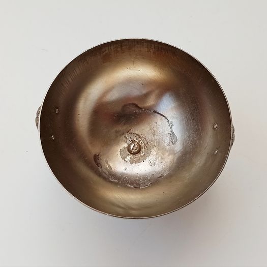 Small silver plated bowl with handles cast as lion's head holding a ring