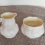 Collection of vintage milk pitchers and matching sugar bowls Image 10