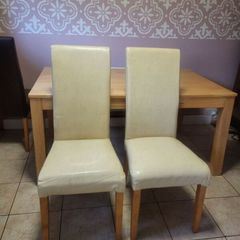 2 cream leather chairs