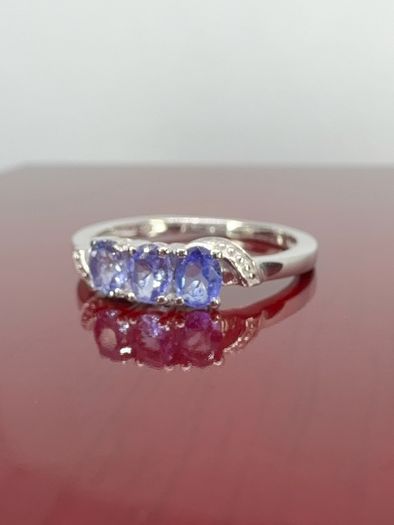 Silver Tanzanite Trilogy Ring in Platinum Overlay Sterling Silver.