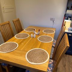Solid oak dining table & 6 reupholstered dining chairs