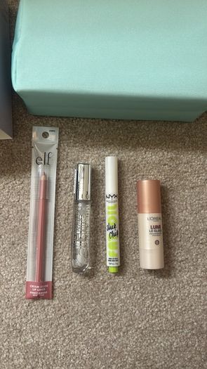 Brand new makeup bag and four brand new products