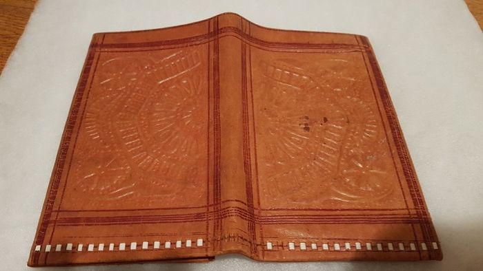 handcrafted made soft leather wallet,with designs ,, thank you,,was used,some wear and tear,,take as is ..