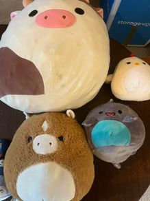 Collection of four Squishmallows plush toys, plus Micromallows
