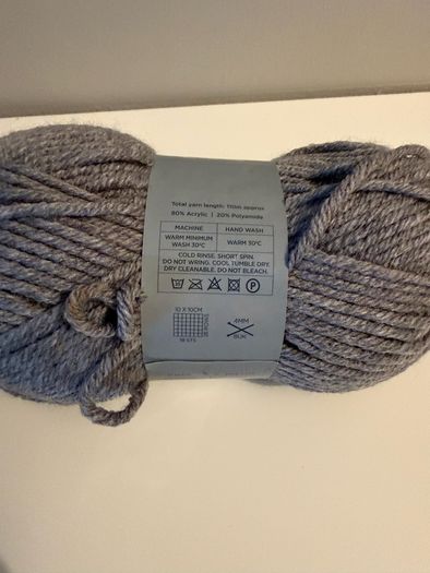 5 balls of grey yarn wool