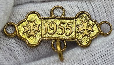 Some sort of gold color medal 1955