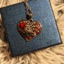 Heart-Shaped Pendant Necklace with Red Glass Heart and Wing Details Image 10