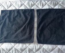 2 black cushion covers