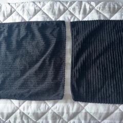 2 black cushion covers