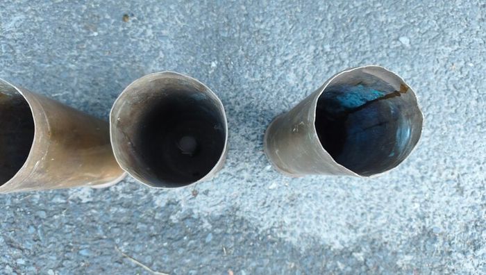 four empty brassartillery shell casings
