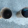four empty brassartillery shell casings Image 3