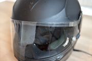 Dainese motorcycle black matte helmet with integrated Bluetooth