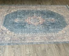 Vintage print rug with matching cushions