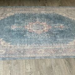 Vintage print rug with matching cushions