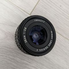Nikon Series E 28mm f/2.8 manual focus wide-angle prime lenses.