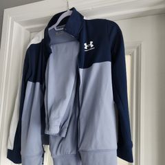 Tracksuit = Under Armour.