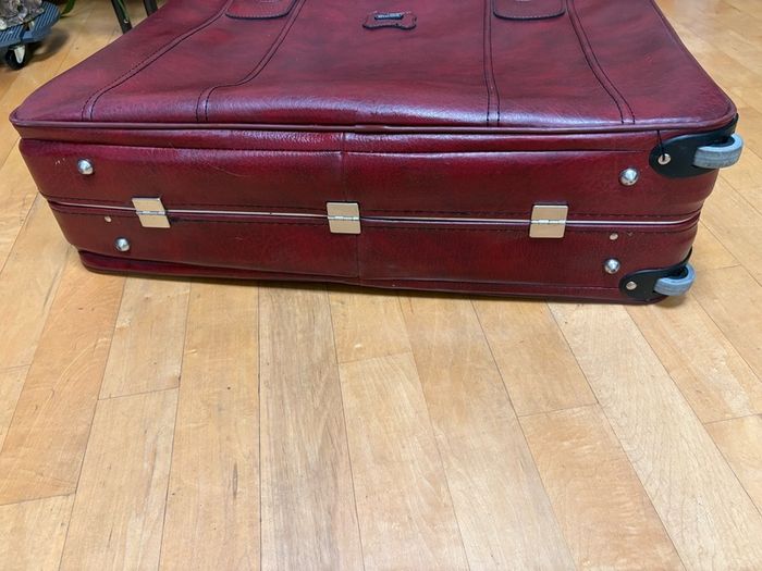 Vintage burgundy faux-leather suitcase