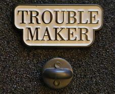 Trouble maker ! pin back badge.