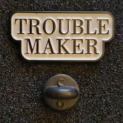 Trouble maker ! pin back badge.