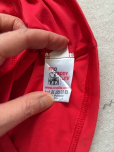 O Neills red size M rash vest