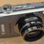 Canon IXUS 1000 HS Digital Camera (High Sensitivity 10 Megapixel, 10x Zoom, 3.0 inch LCD Screen) - Grey Image 7
