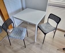 IKEA table, 75x75x74 with 2 chairs. Seat covers included for FREE!