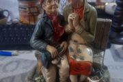 Vintage 1972 Naturecraft Stoneware Figurine, Titled Celebration, depicting an elderly couple sitting on a bench