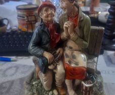Vintage 1972 Naturecraft Stoneware Figurine, Titled Celebration, depicting an elderly couple sitting on a bench